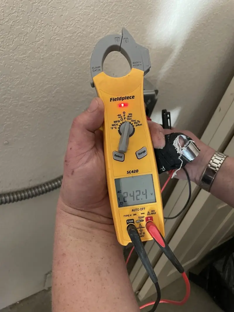 Voltage testing with clamp meter during Ceiling Fan Installation in Hemet